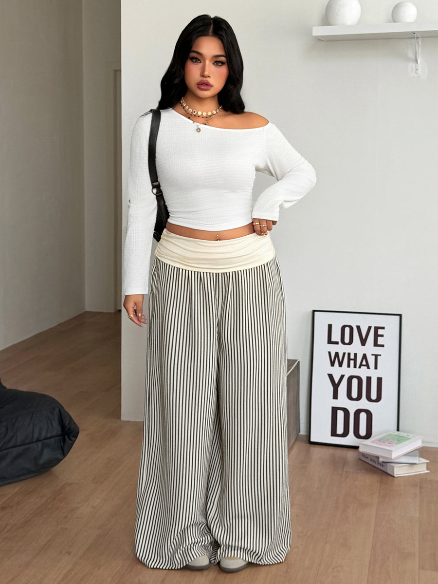Women's plus size wide leg cotton pants featuring a relaxed loose fit and high waist design.
