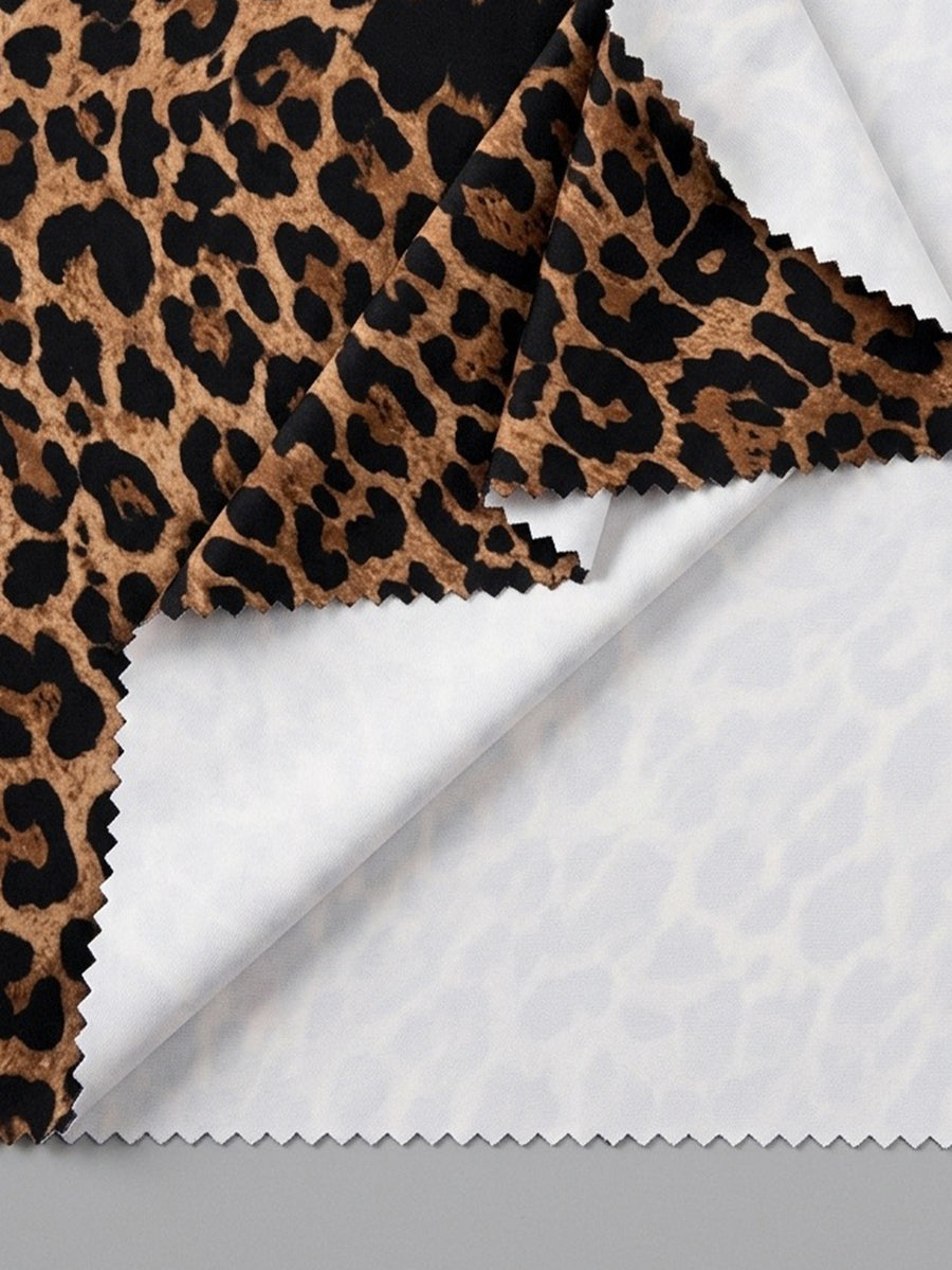 Women's black leopard print flare leg sweatpants with an elastic mid waist crafted from cotton knitted fabric.