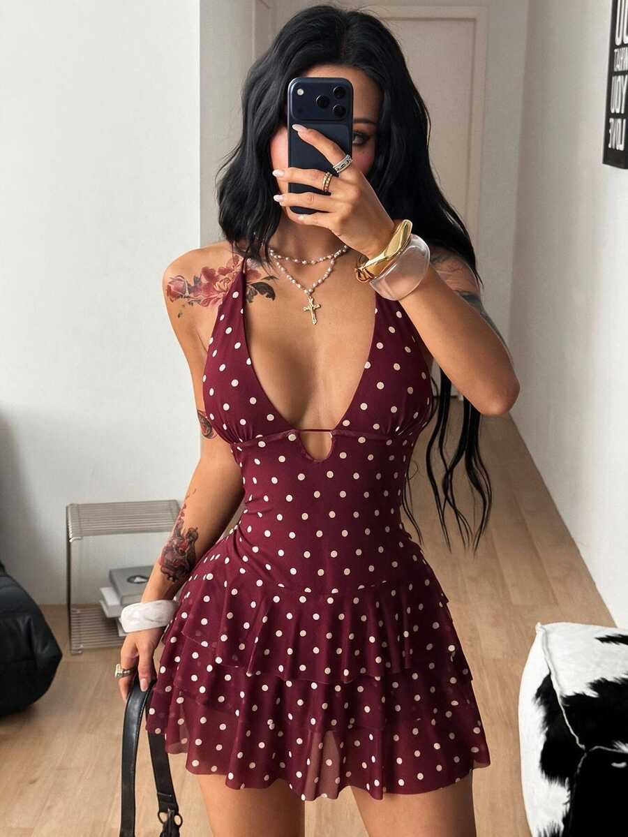 Front view of a women's lace halter mini dress featuring a slim-fit bodice, flared hem, and sleeveless design.