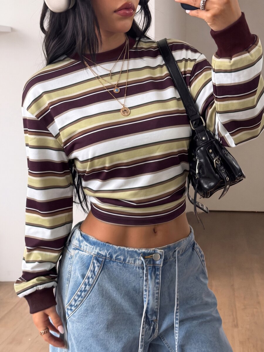 Women's striped pullover sweatshirt featuring drop shoulder long sleeves and a classic round neckline.