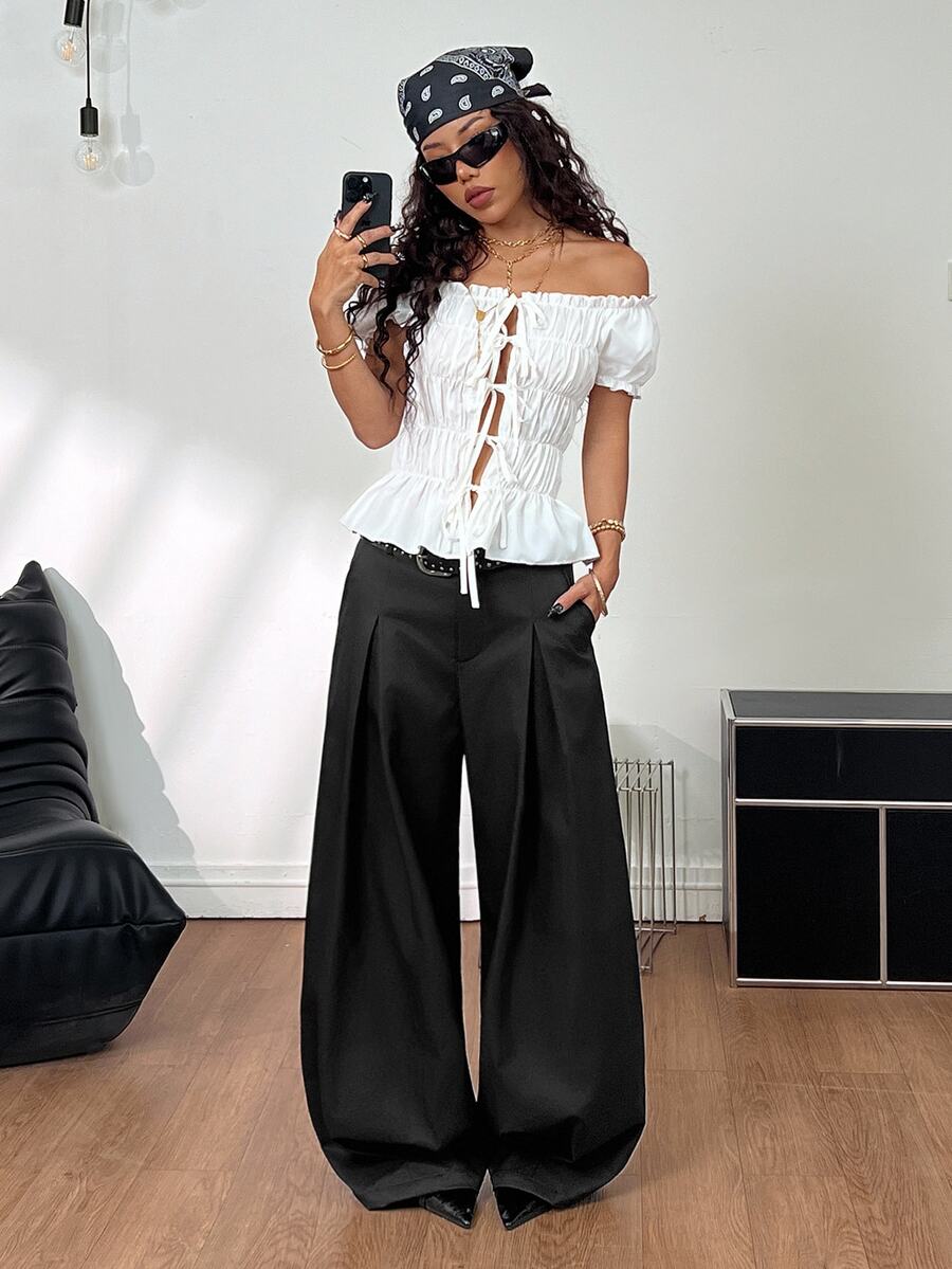 Casual black striped woven long pants for women featuring a low waist and loose fit design.