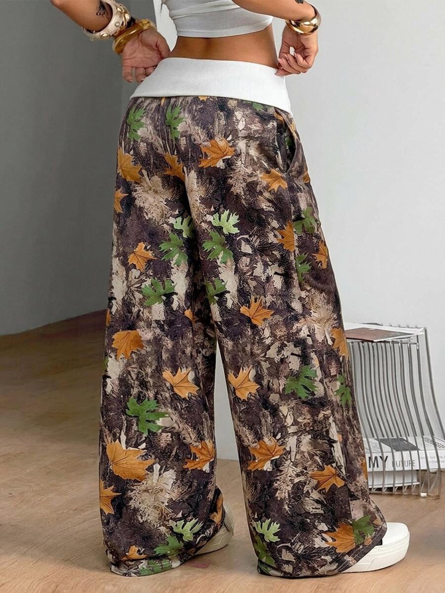 Women's wide leg trousers with a tree branch graphic pattern, loose fit, and mid-rise waist in woven fabric.