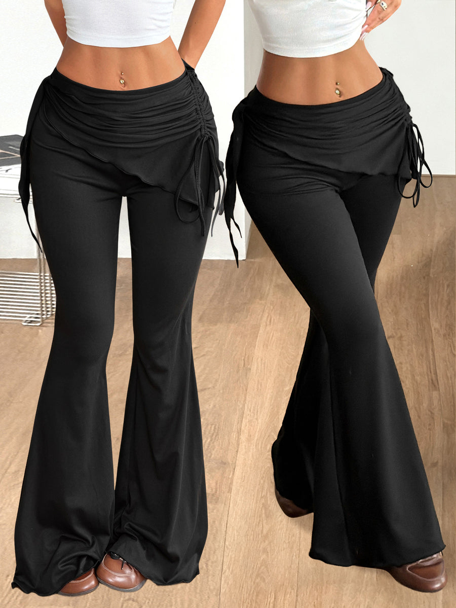 Women's black low rise flare pants with split hem detailing and stretchy knit fabric