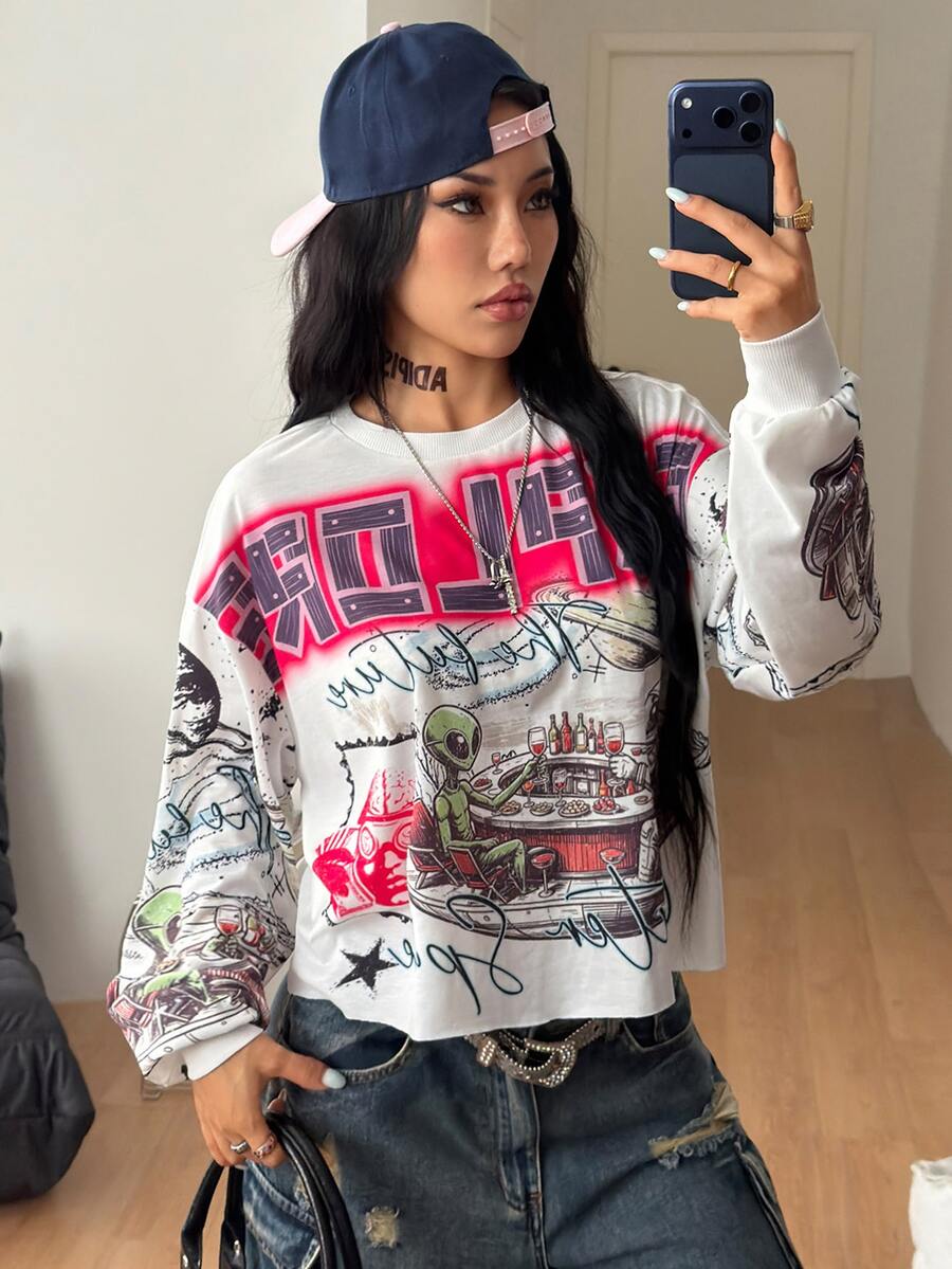 Women's white oversized long sleeve graphic T-shirt with drop shoulders and a round neckline.