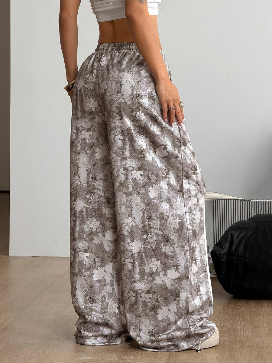 Women's loose fit wide leg graphic sweatpants in light grey with an elastic drawstring waistband
