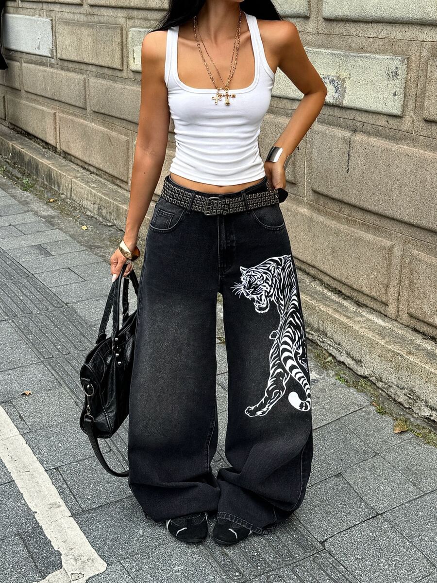 Front view of women's loose wide leg denim jeans featuring a mid waist, classic front pockets, and a zipper fly closure.