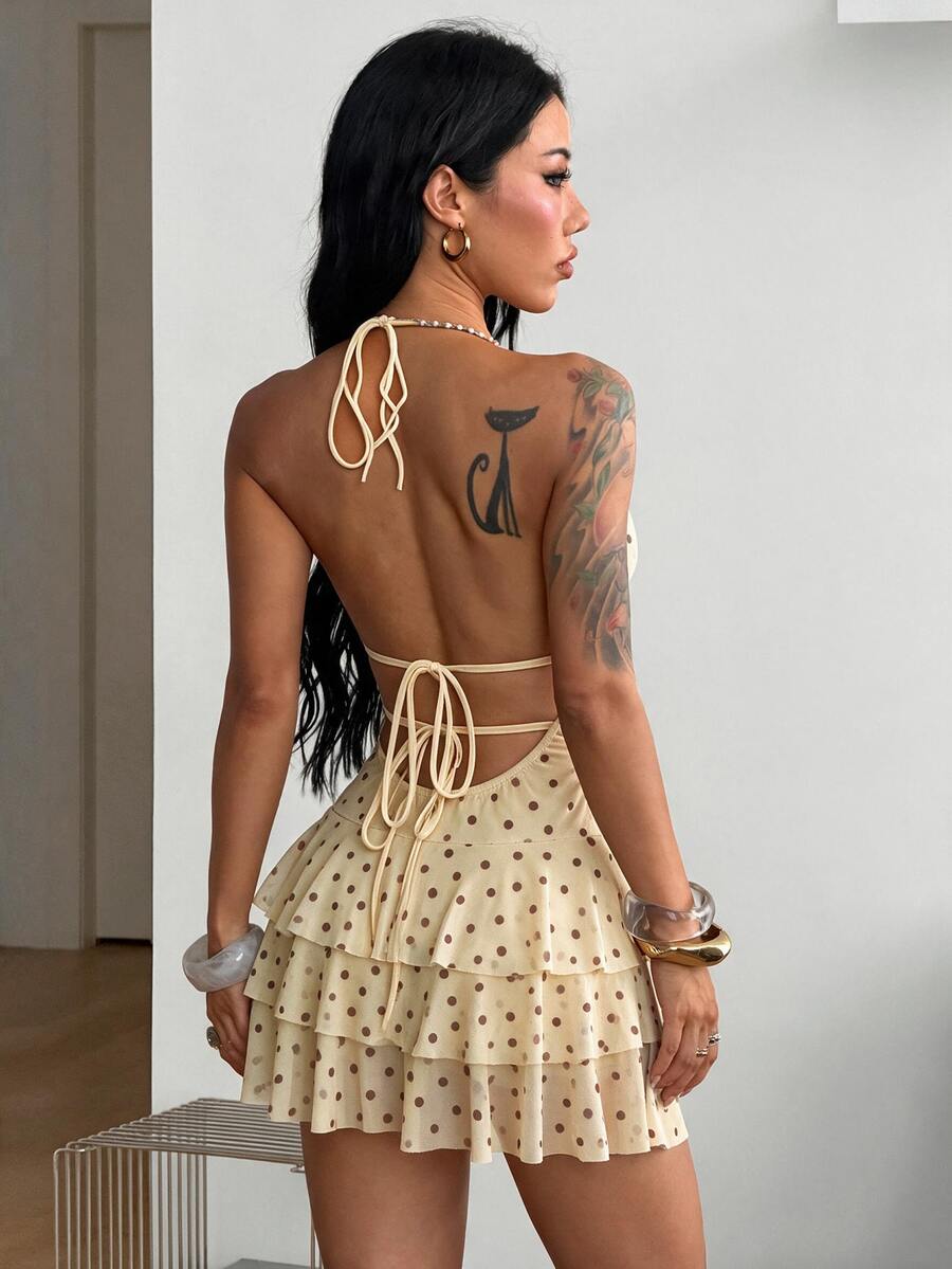 Front view of a women's lace halter mini dress featuring a slim-fit bodice, flared hem, and sleeveless design.