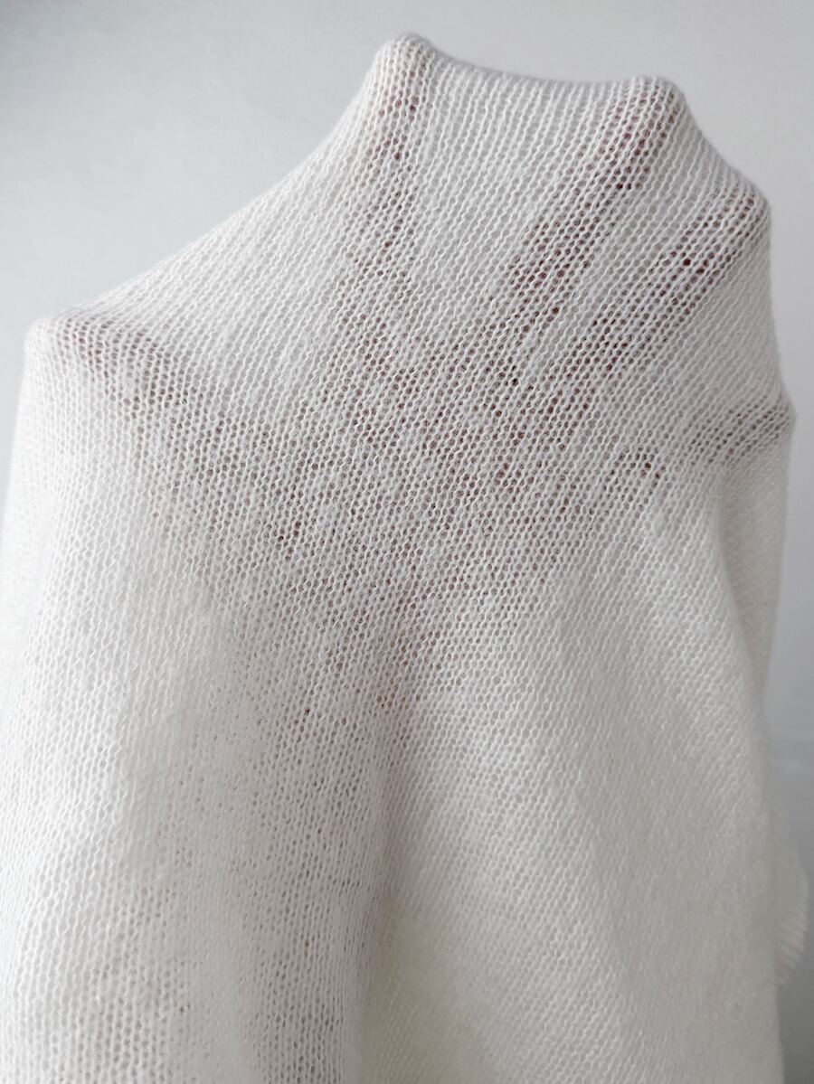 White cold shoulder sweater for women featuring a loose fit, asymmetrical neckline, raglan sleeves, and rib-knit texture.