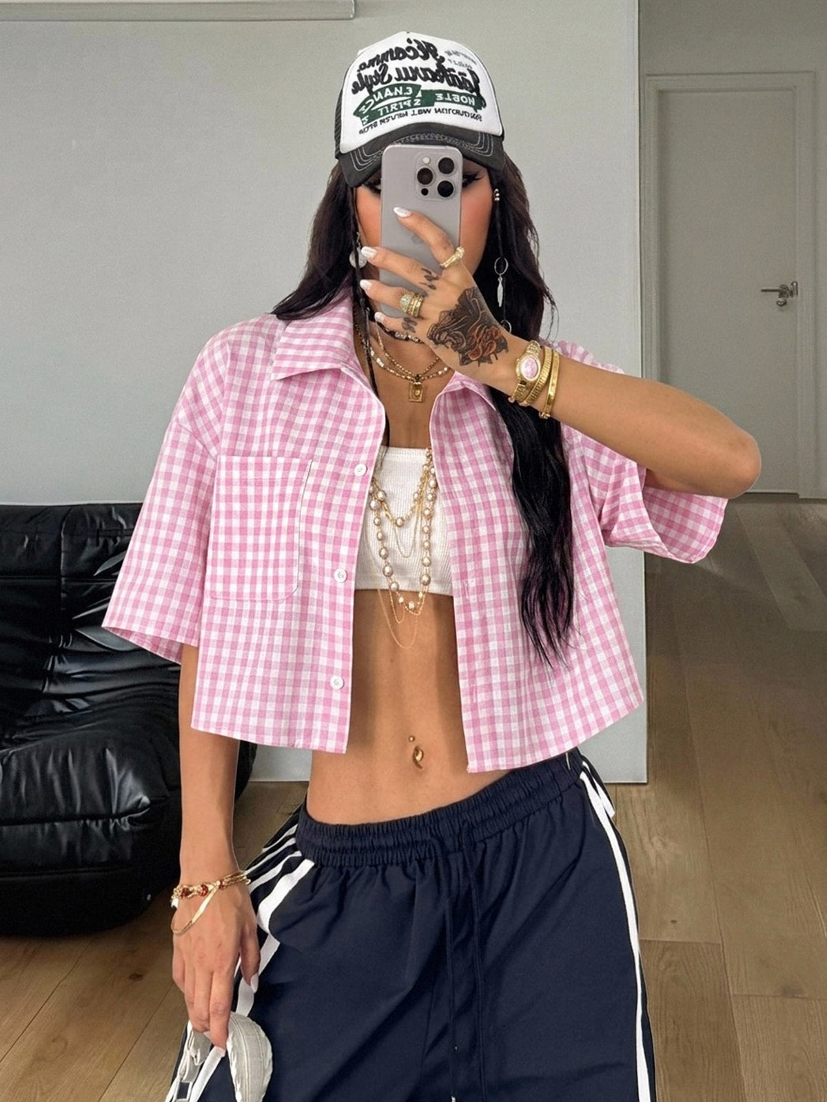 Women's plaid crop shirt with button front, chest pocket, short sleeves, and loose casual fit.