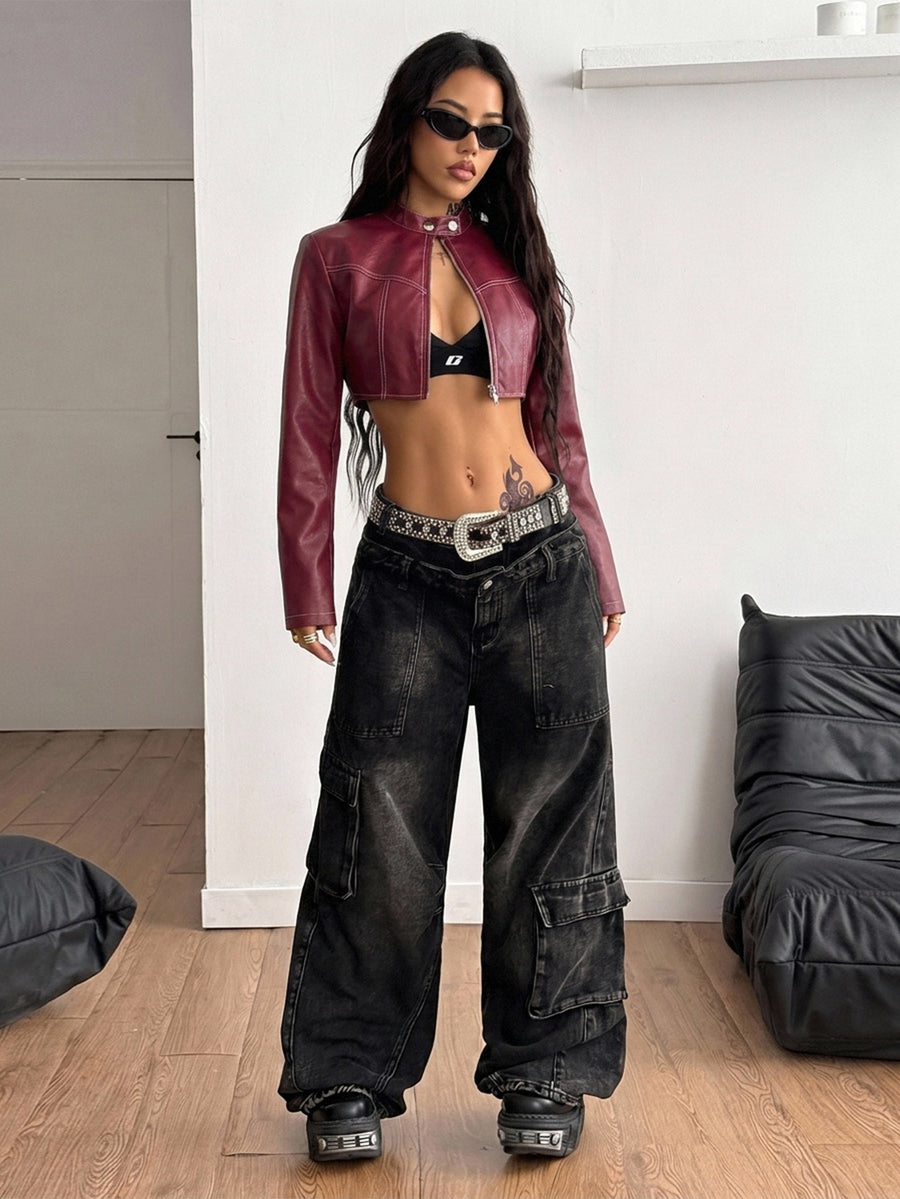 Front view of a women's black cropped PU leather jacket featuring a stand collar, long sleeves, and front zipper closure.