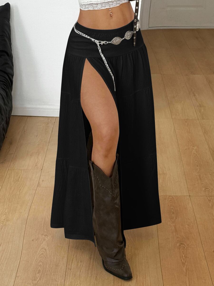 Women's red plaid long skirt featuring a low-rise waist and a side slit in lightweight woven fabric.