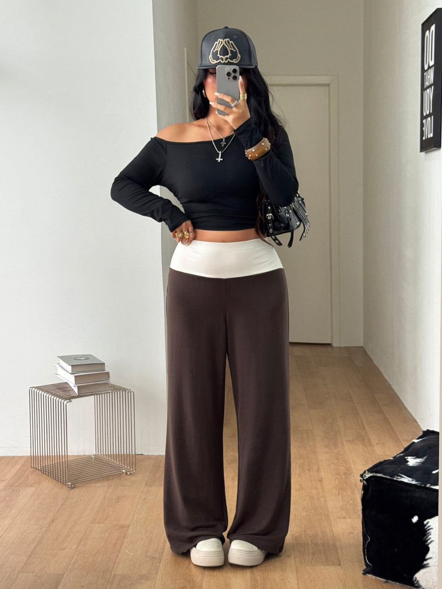 Women's casual straight leg sweatpants featuring a black and white polka dot design with an elastic waistband.