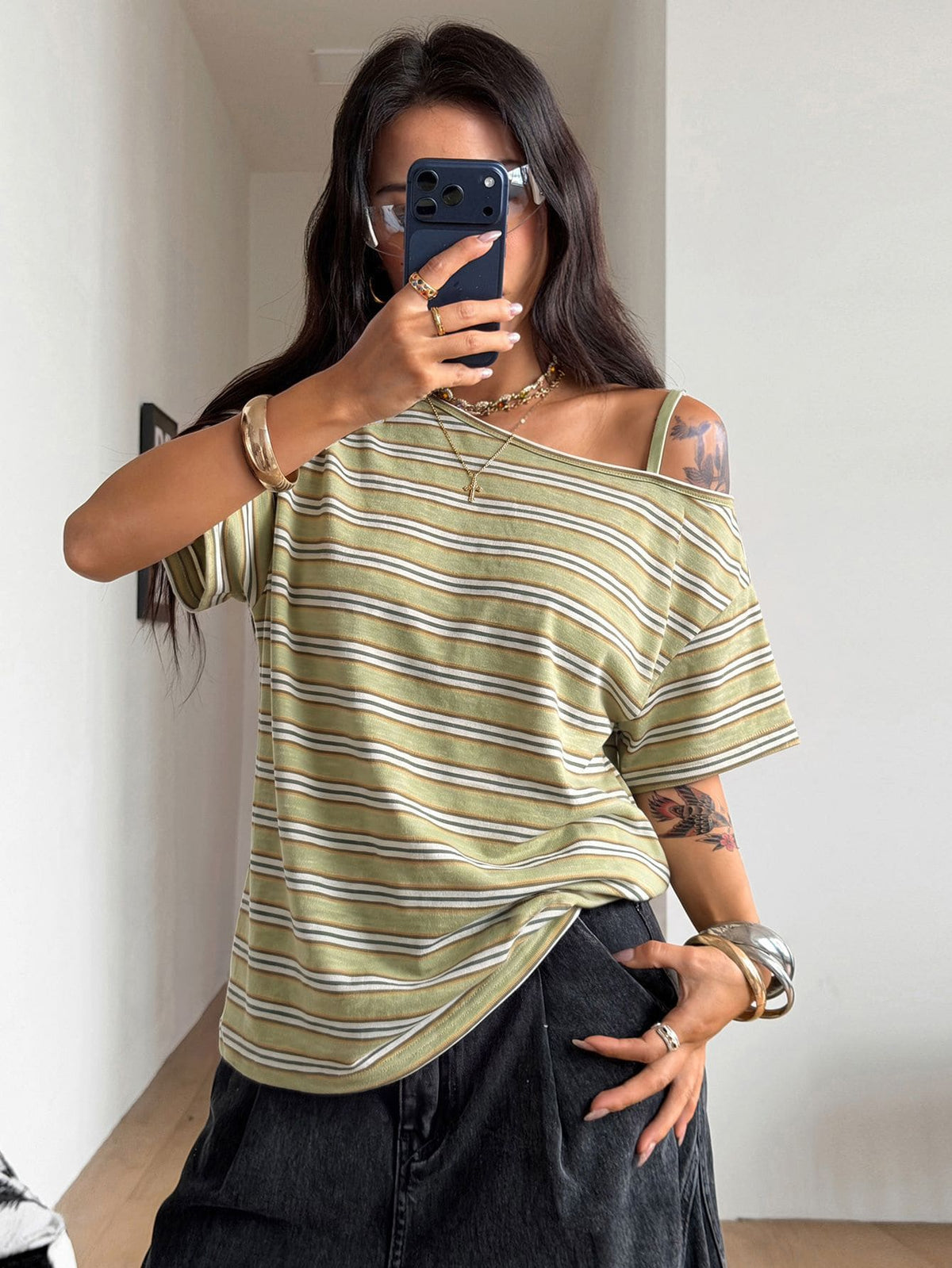 Women's casual loose fit cold shoulder cotton t-shirt with asymmetrical cutout neckline and short sleeves.