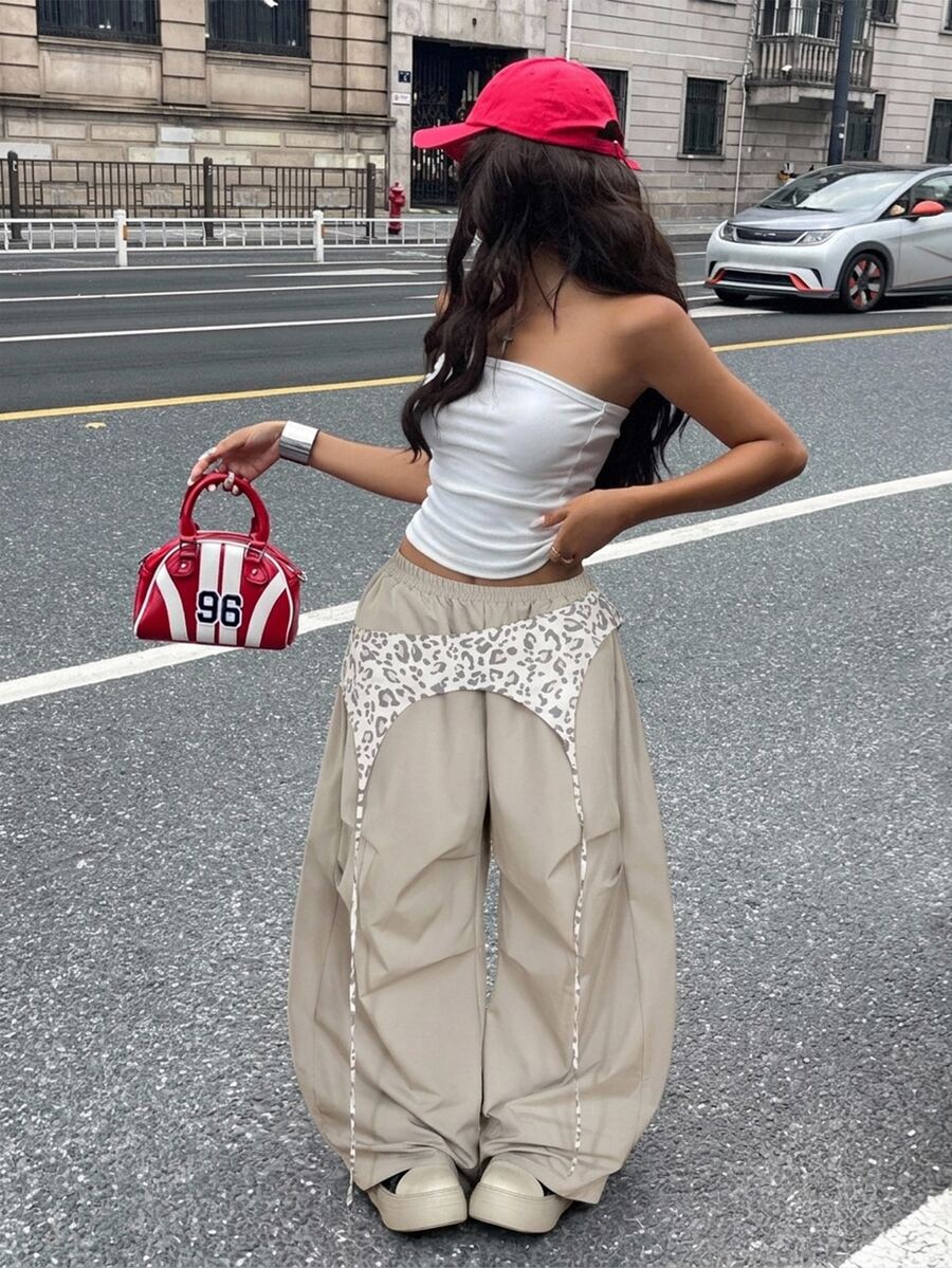 Women's casual wide leg long pants featuring an elastic drawstring waistband and loose fit silhouette.