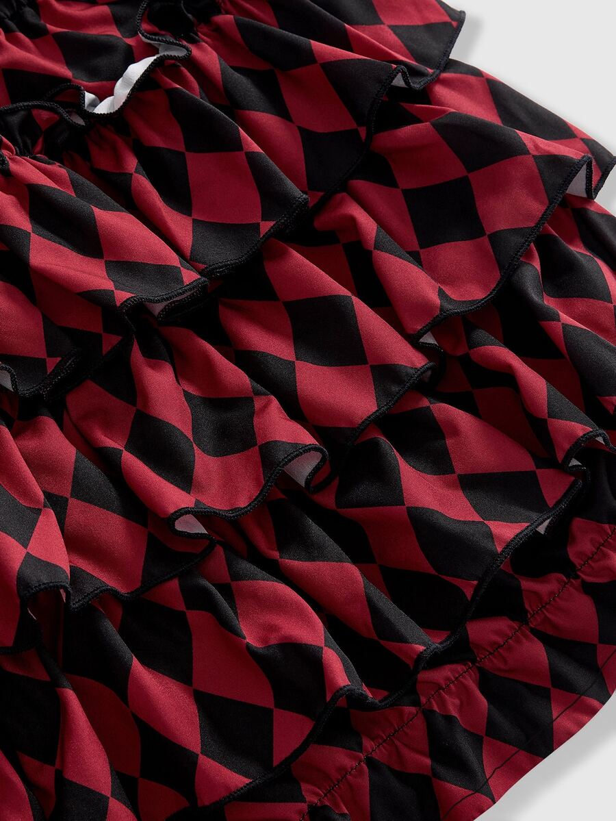 Women's gothic patchwork pumpkin shorts with tiered ruffle hem and geometric striped plaid pattern.