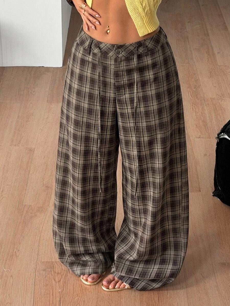 Women's casual straight leg striped woven pants featuring a low waist and zipper fly closure.