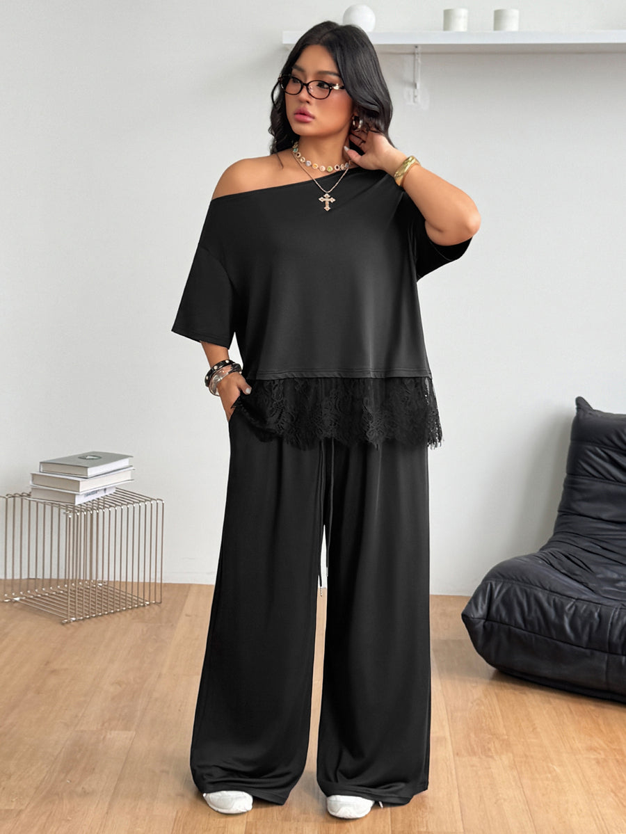 Women's two-piece lounge set featuring a loose drop shoulder asymmetrical neck short sleeve t-shirt and wide-leg knit pants with pockets.