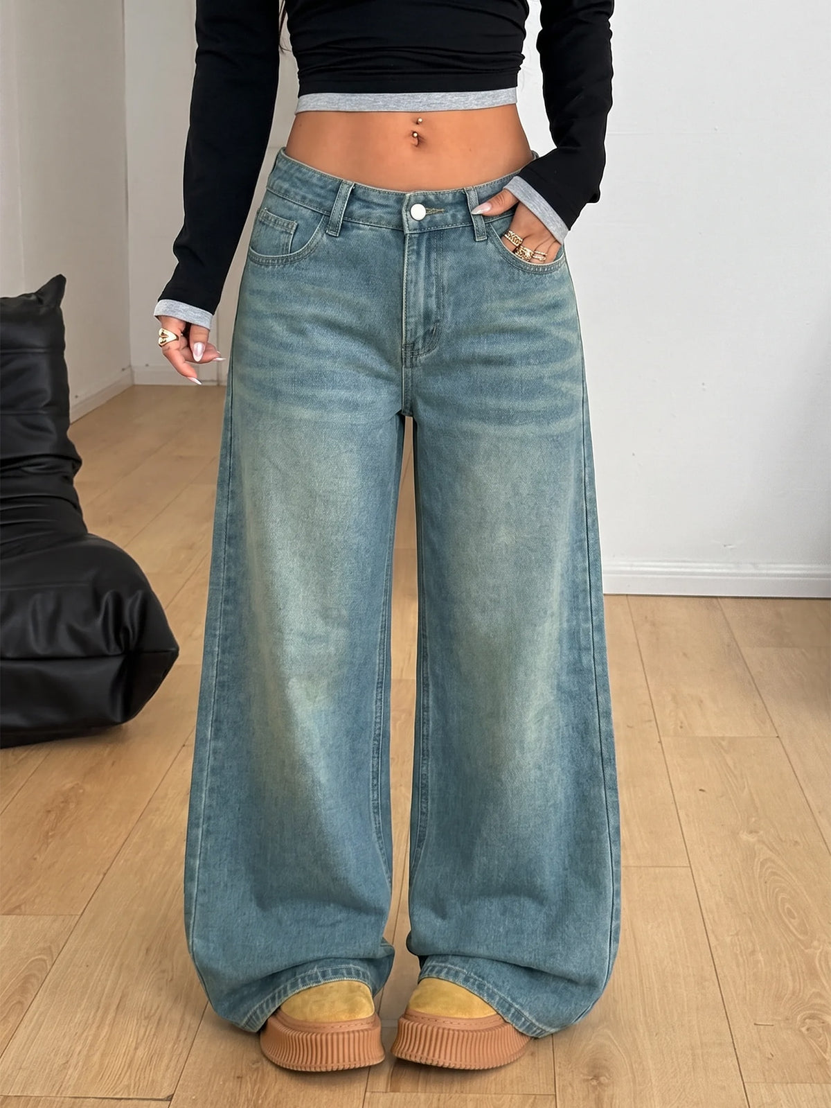 Women's loose wide-leg jeans in light wash denim with low waist and extra-long relaxed fit