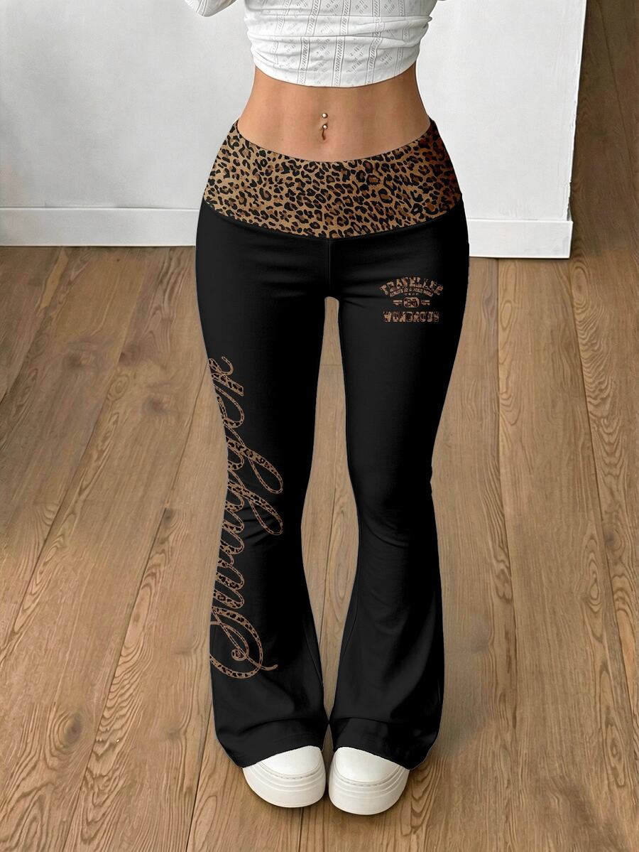 Women's black leopard print flare leg sweatpants with an elastic mid waist crafted from cotton knitted fabric.