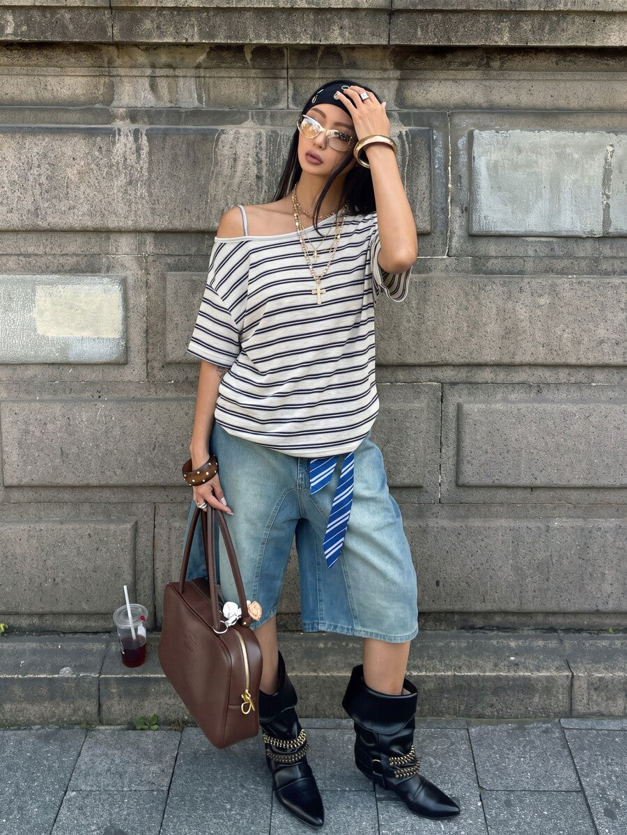 Women's casual loose fit cold shoulder cotton t-shirt with asymmetrical cutout neckline and short sleeves.