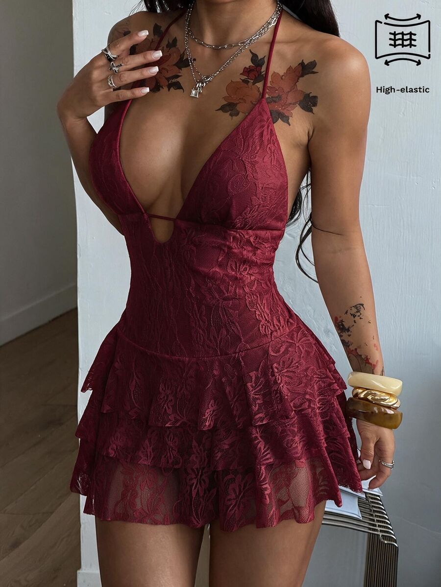 Front view of a women's lace halter mini dress featuring a slim-fit bodice, flared hem, and sleeveless design.