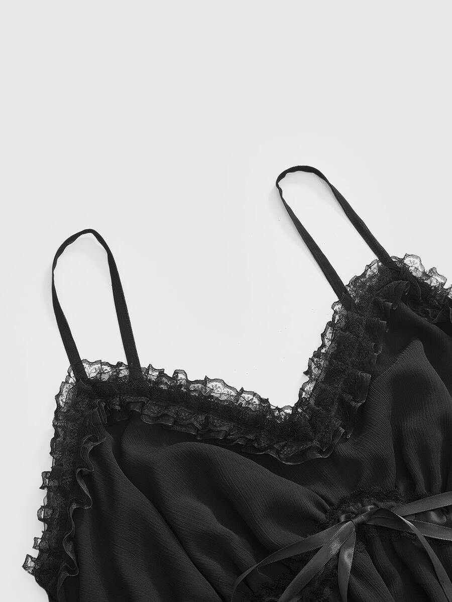 Front view of a black goth cami mini dress featuring cold shoulder spaghetti straps, chiffon fabric, and a tiered ruffle flounce hem.