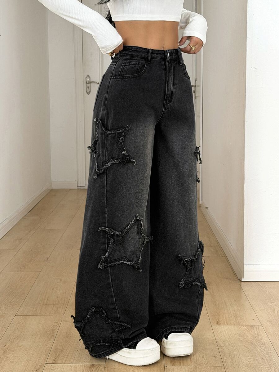 Front view of women's loose wide leg denim jeans featuring a mid waist, classic front pockets, and a zipper fly closure.