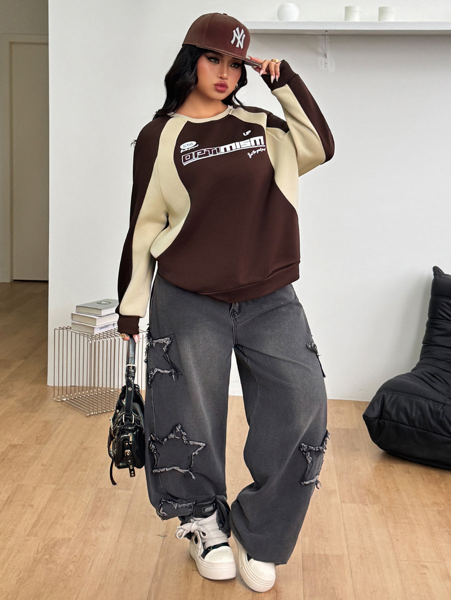 Color-blocked loose pullover sweatshirt with a round neckline, raglan sleeves, and ribbed knit trim.