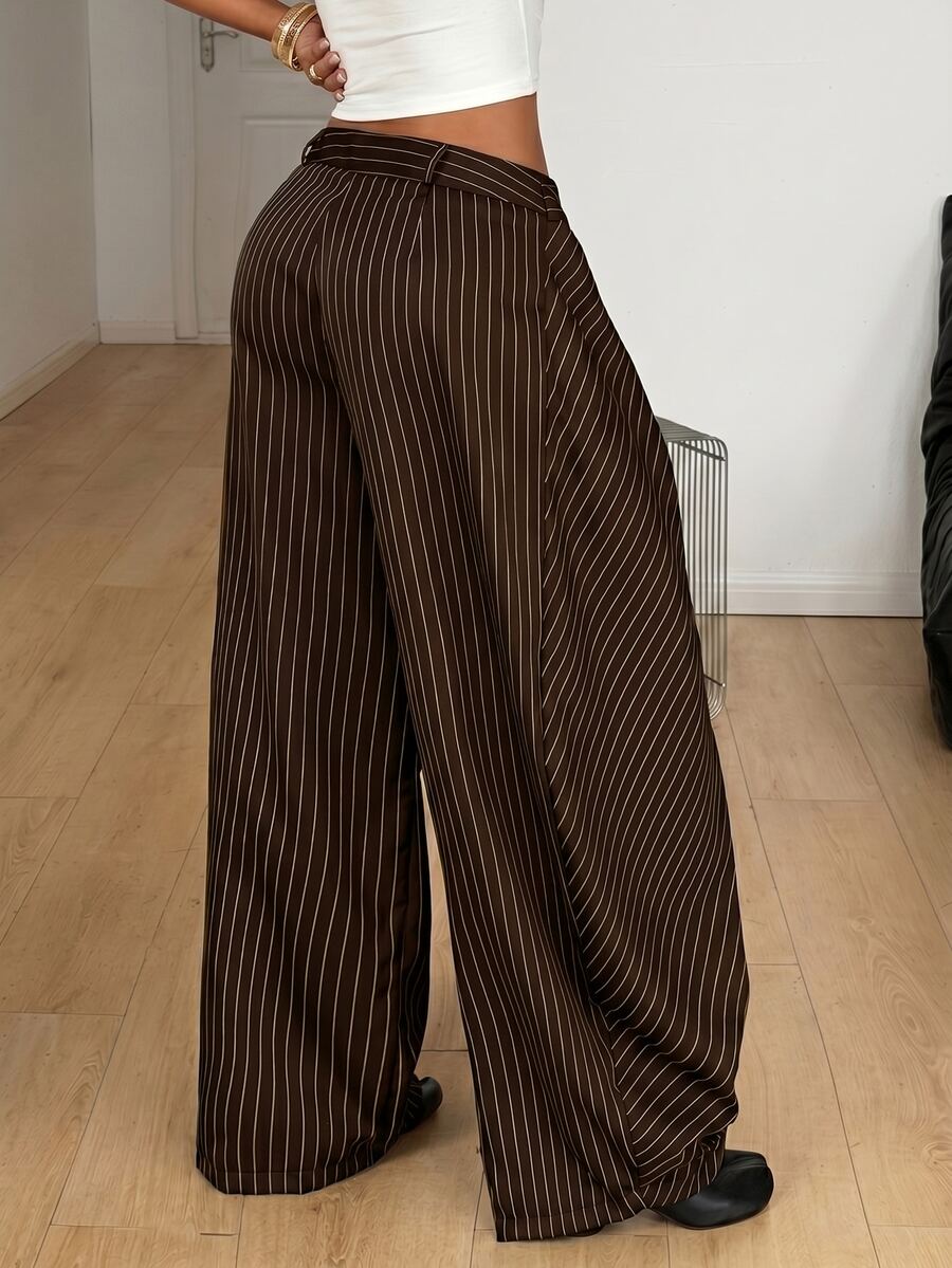 Women's loose fit pleated wide leg pants in royal blue pinstripe woven fabric with zipper fly closure.