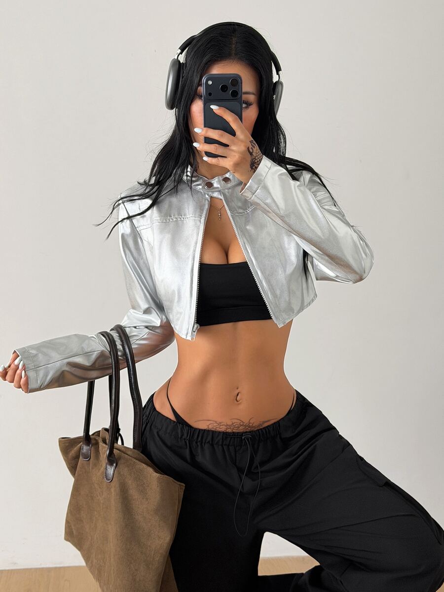 Women's metallic silver cropped lightweight zip-up jacket with long sleeves and a stand collar.