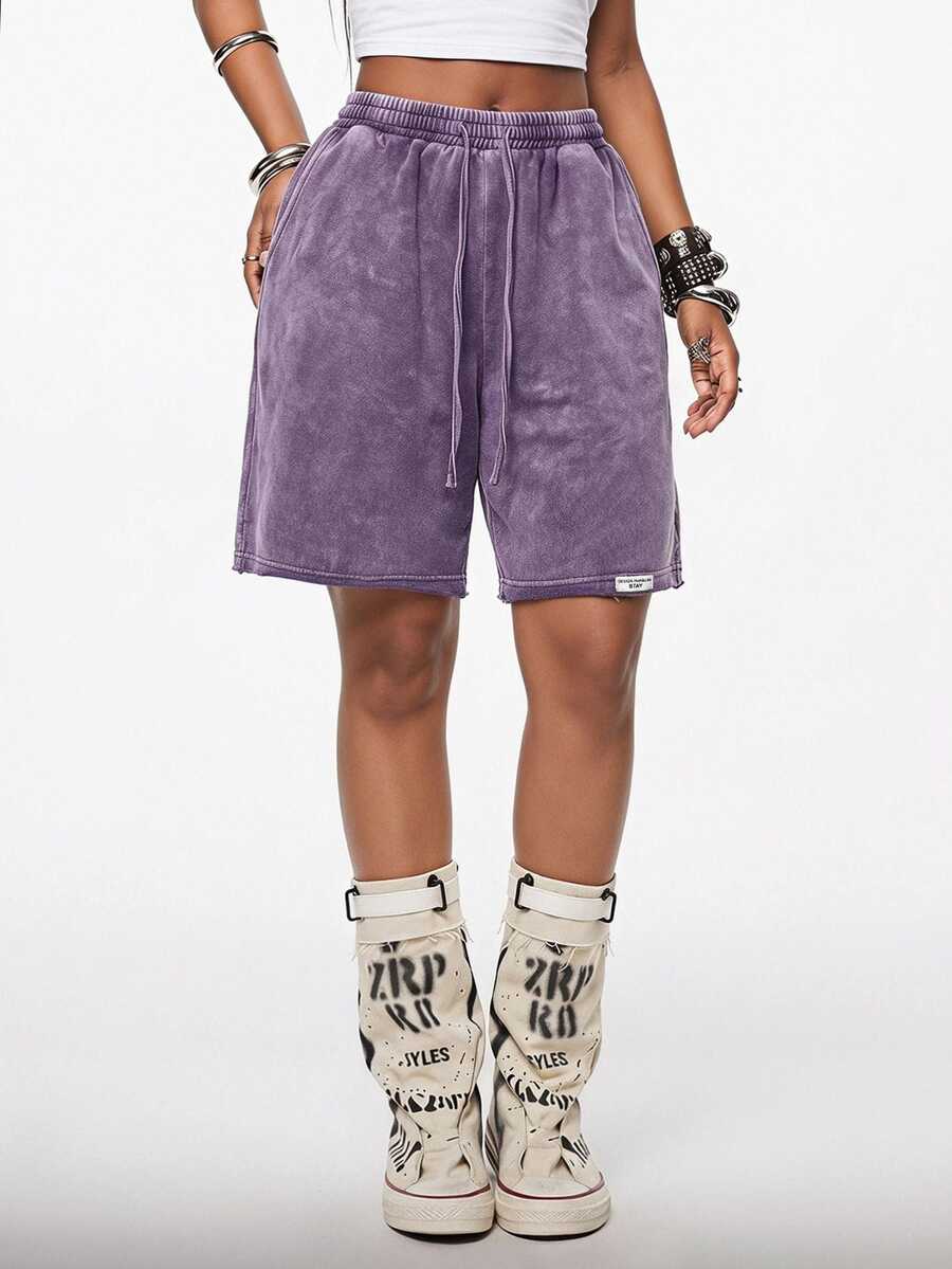Women's loose fit dark grey track Bermuda shorts featuring an elastic drawstring waistband and side slit hem.