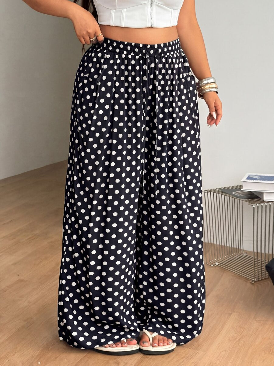 Plus size women's striped loose straight leg cropped pants with pleated detailing and side pockets