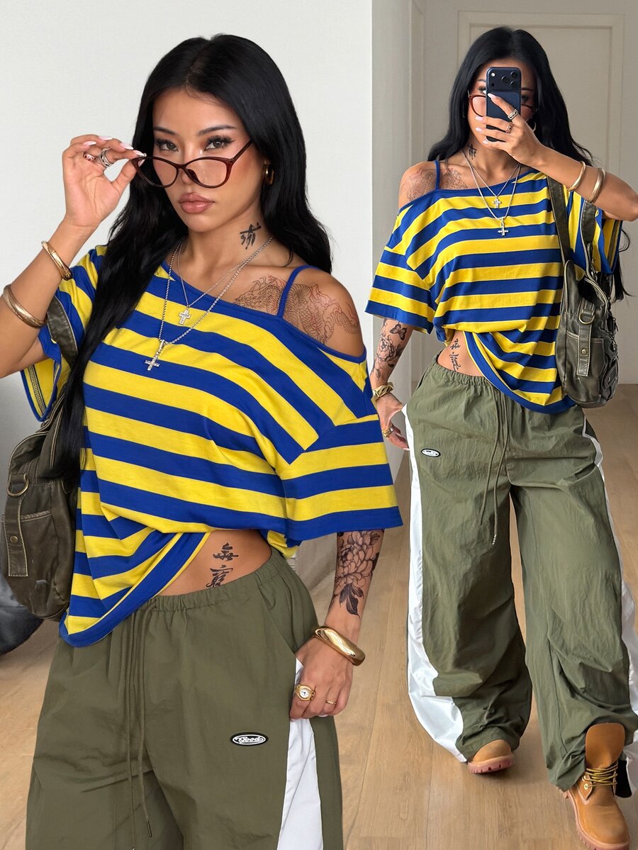 Women's casual loose fit cold shoulder cotton t-shirt with asymmetrical cutout neckline and short sleeves.