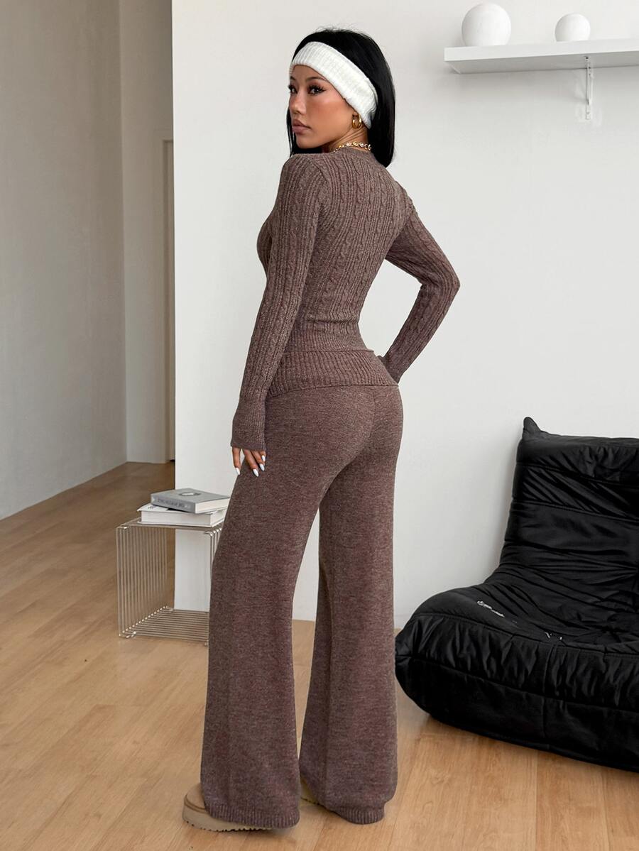 Women's brown ribbed knit two-piece sweater set featuring a long sleeve V-neck top and wide leg flare pants.