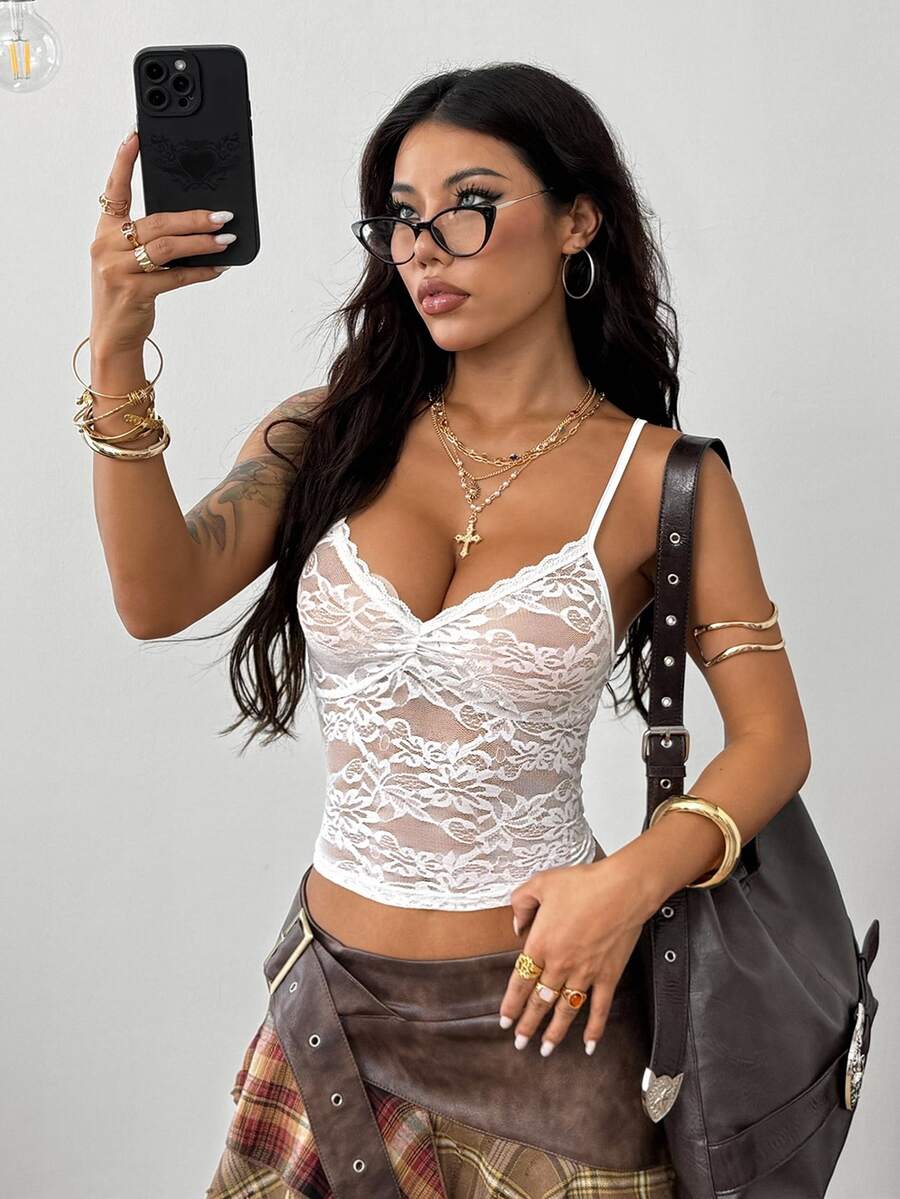 Women's black lace crop cami top featuring spaghetti straps, cold shoulder sleeves, and a sheer backless design.