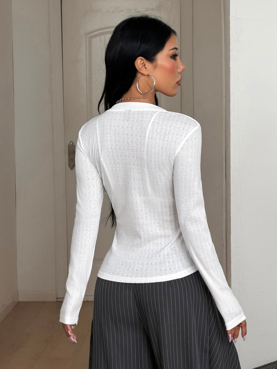 Women's slim fit ribbed knit henley shirt with long sleeves and front button placket detail.