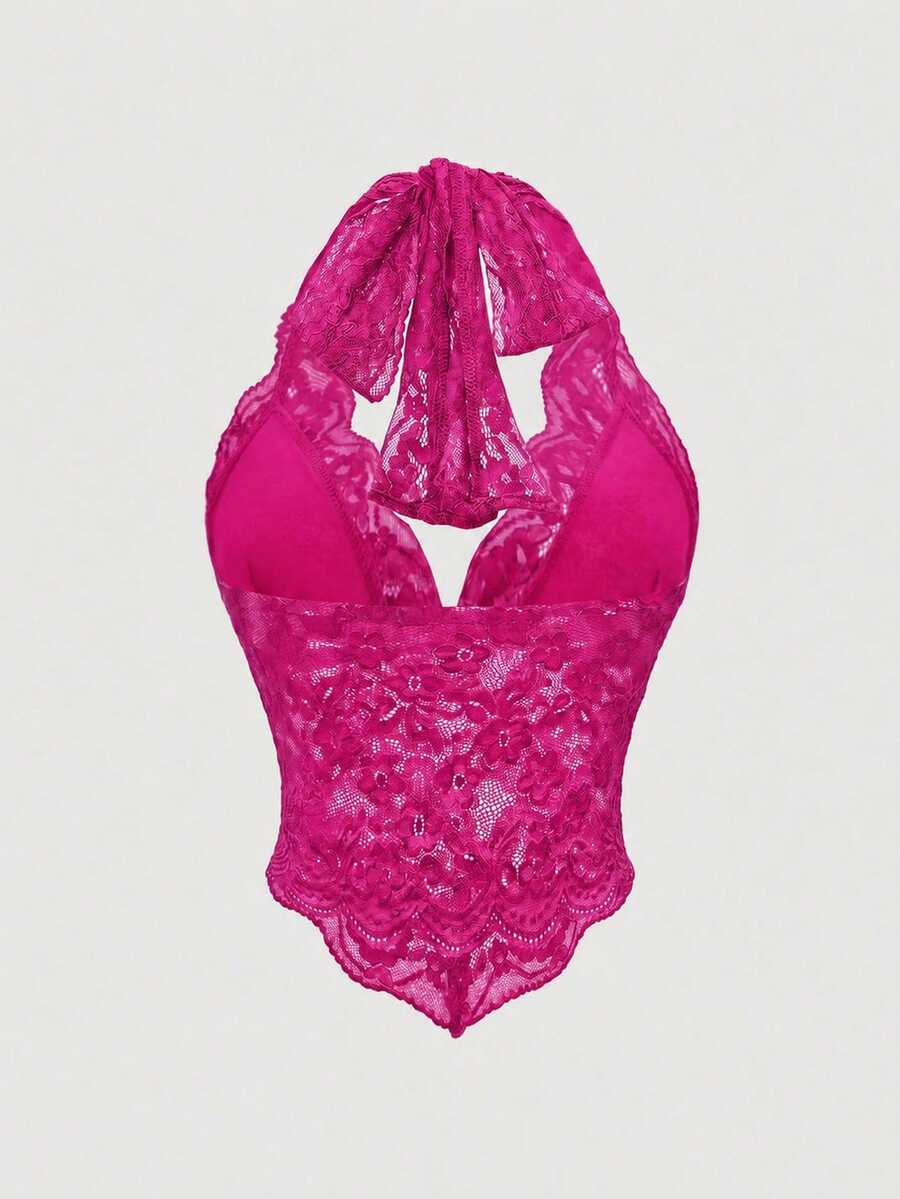 Women's lace halter neck crop top with backless tie closure, scallop trim, and asymmetrical hem.