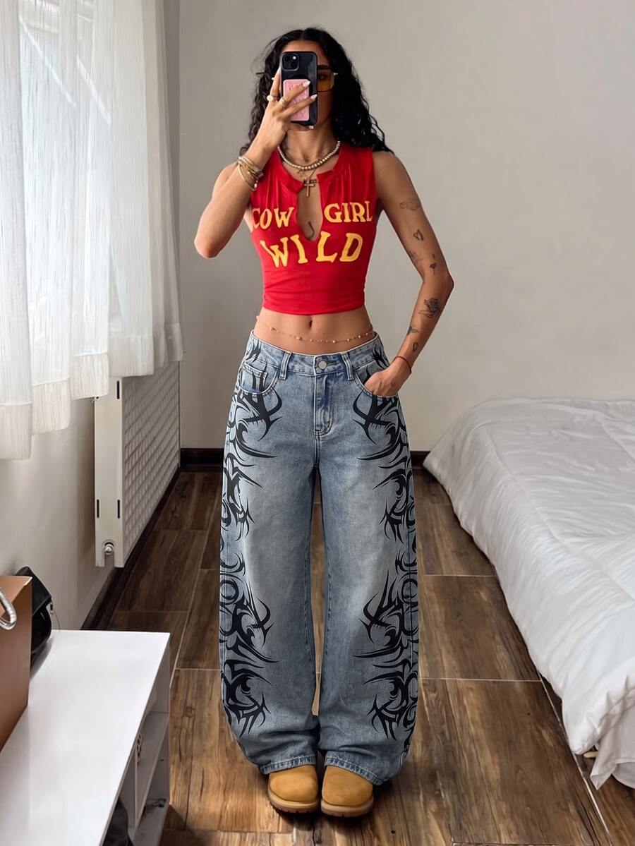 Front view of women's loose wide leg denim jeans featuring a mid waist, classic front pockets, and a zipper fly closure.