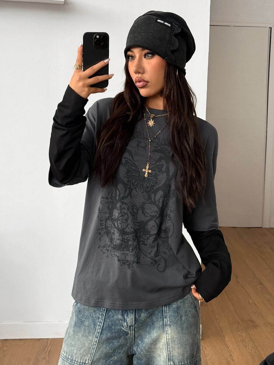 Women's casual graphic long sleeve t-shirt with a round neck, drop shoulder sleeves, and loose relaxed fit.