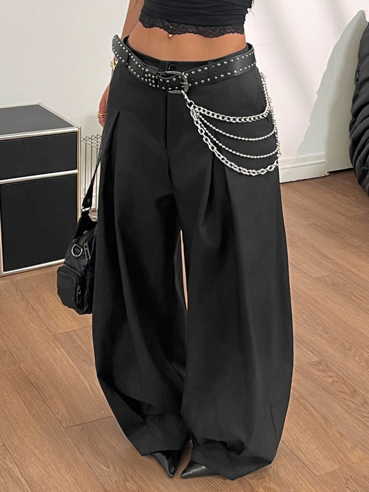 Casual black striped woven long pants for women featuring a low waist and loose fit design.