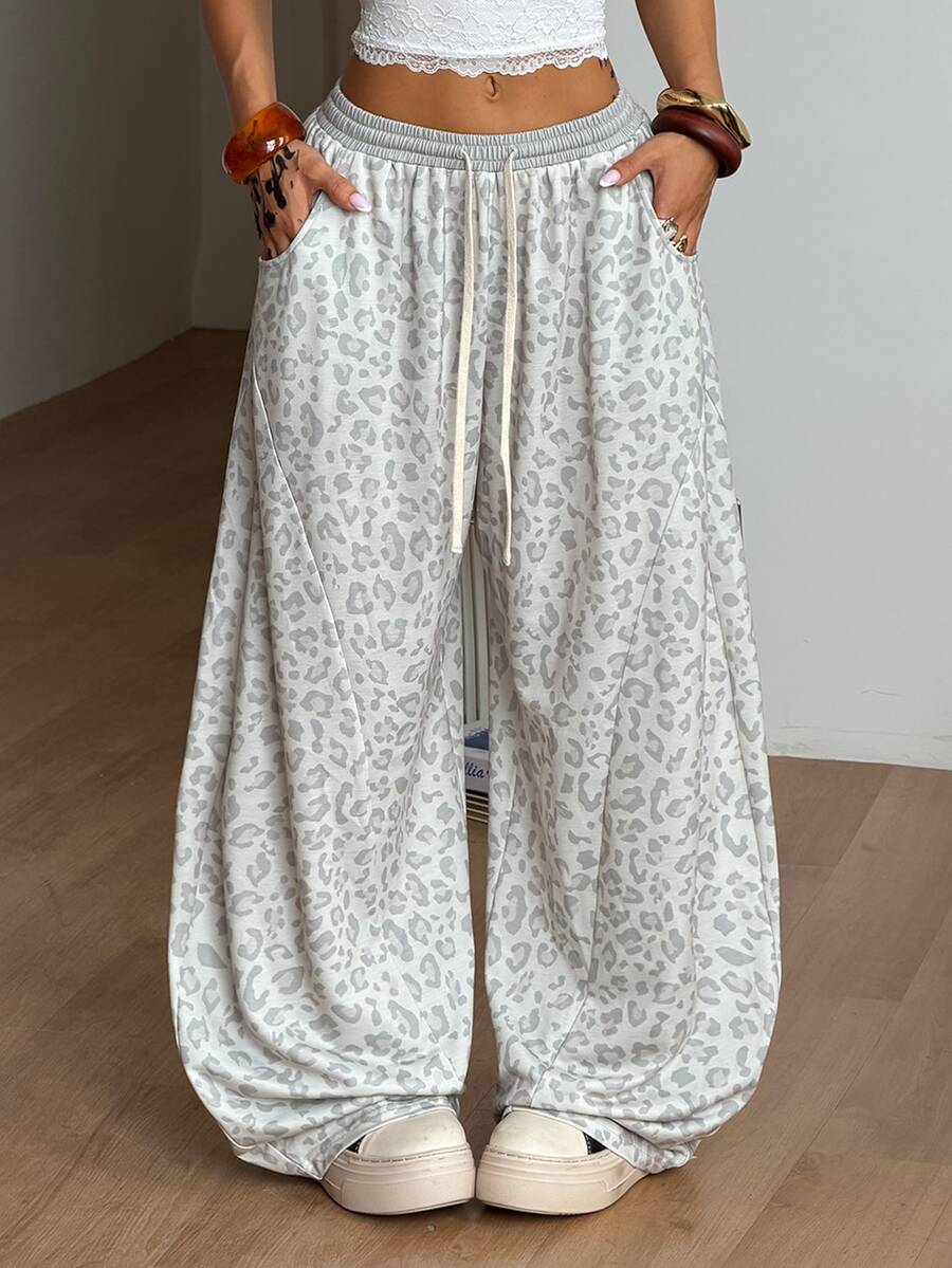 Women's casual grey plaid sweatpants featuring an elastic drawstring waistband, side pockets, and a relaxed loose fit.