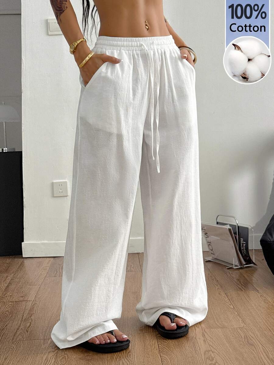 Plus size women's striped loose straight leg cropped pants with pleated detailing and side pockets