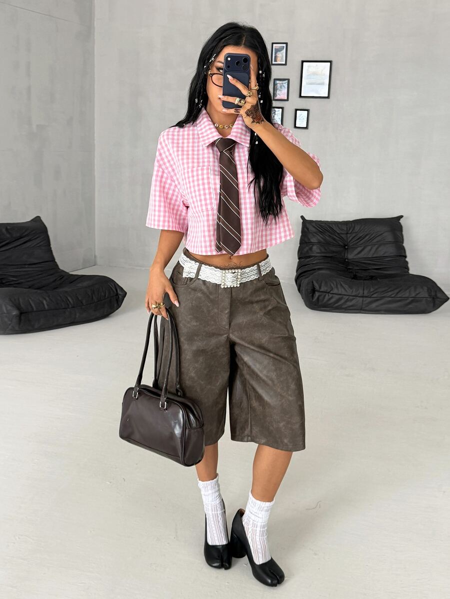 Women's plaid crop shirt with button front, chest pocket, short sleeves, and loose casual fit.