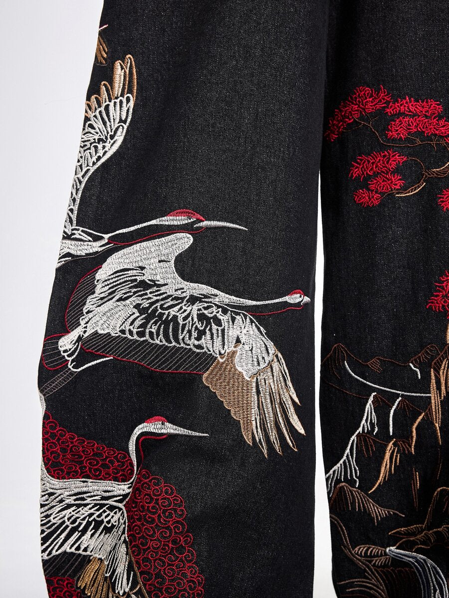 Women's black loose wide leg jeans with detailed crane and landscape embroidery, zipper fly, and ultra low waist.