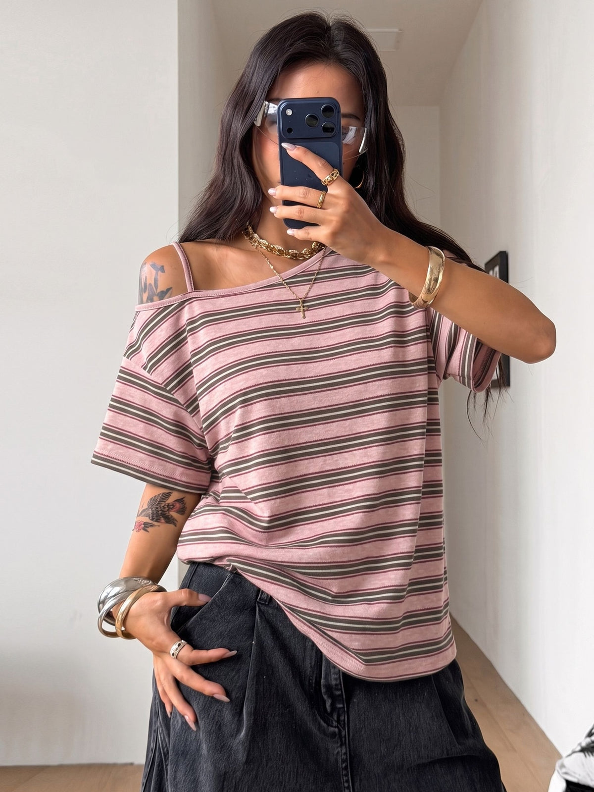 Women's casual loose fit cold shoulder cotton t-shirt with asymmetrical cutout neckline and short sleeves.