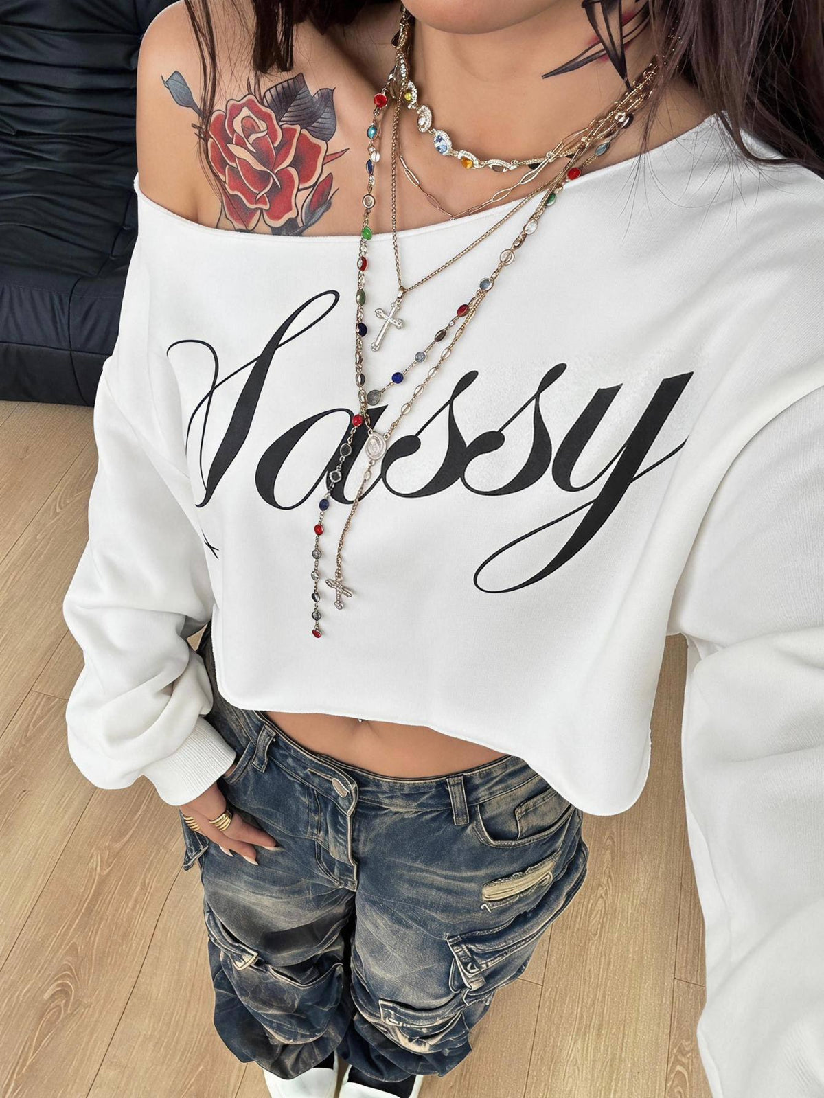 Plus size women's cropped leopard print sweatshirt featuring an asymmetrical neckline and long drop-shoulder sleeves.
