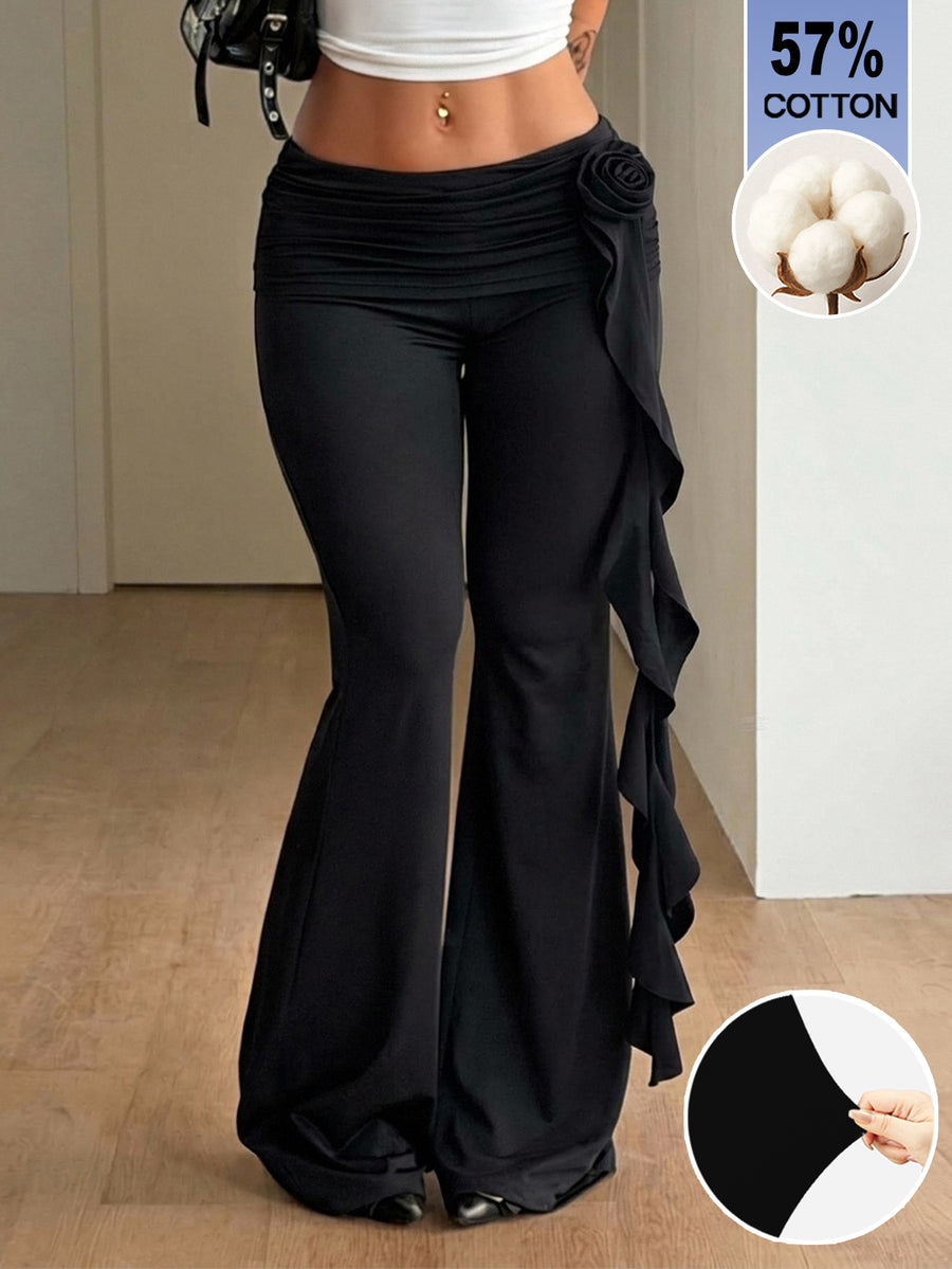 Black low waist flare pants featuring 3D rose and side stripe detailing in stretchy mesh fabric.