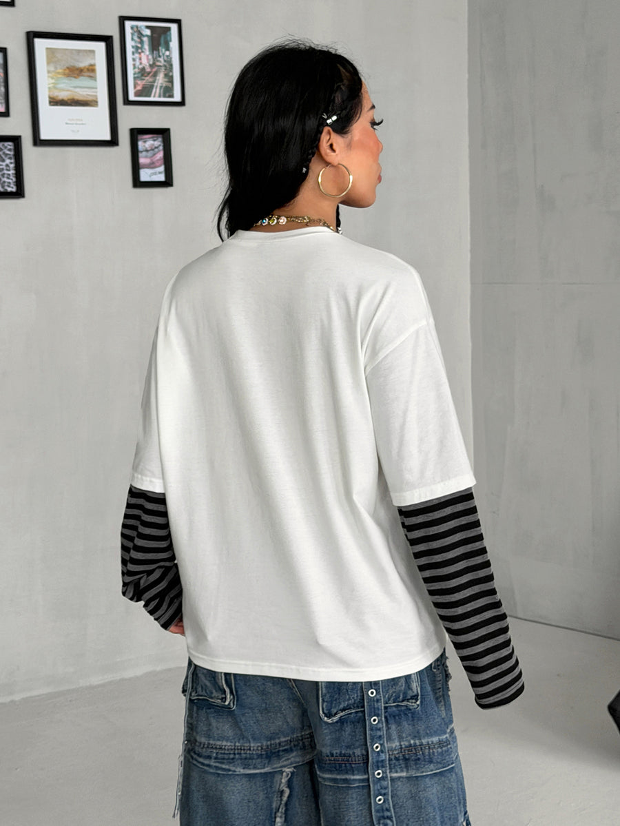Women's casual graphic long sleeve t-shirt with a round neck, drop shoulder sleeves, and loose relaxed fit.