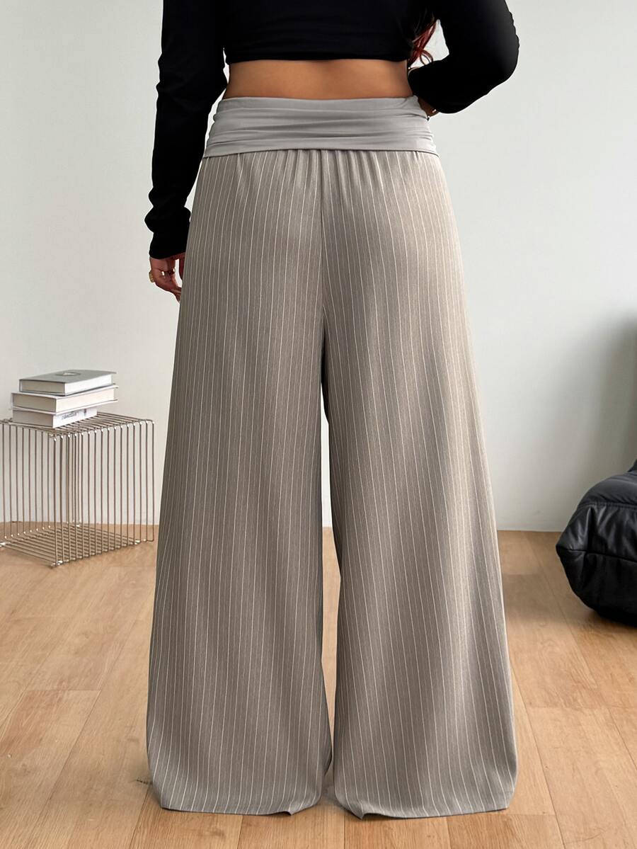 Women's plus size wide leg cotton pants featuring a relaxed loose fit and high waist design.