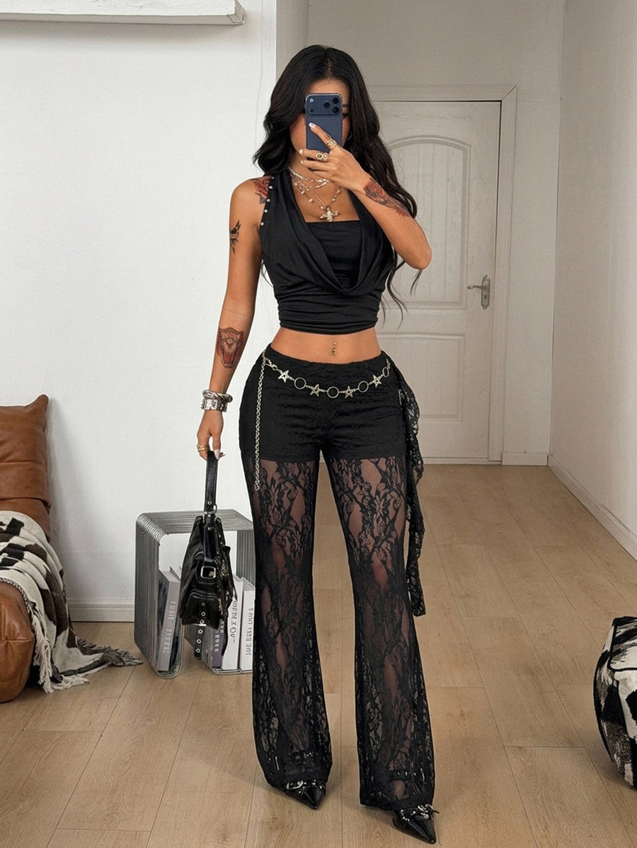 Women's black and white polka dot flare leg pants with side drawstring and ruched details